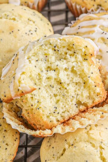 Lemon Poppy Seed Muffins stacked on a rack