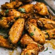 Crispy glazed chicken wings with herbs, served with dipping sauce at Citrus & Charm Brunchery.